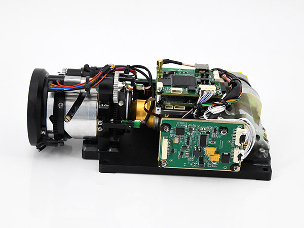 Cooled thermal module/core with lens