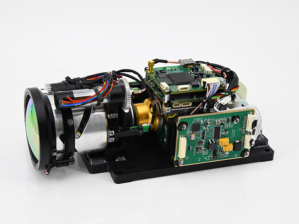 Cooled thermal module/core with lens